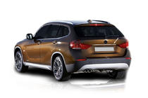 BMW X1 E84 2009-2015 Baguette inox au-dessus de la plaque d'immatriculation photo 1