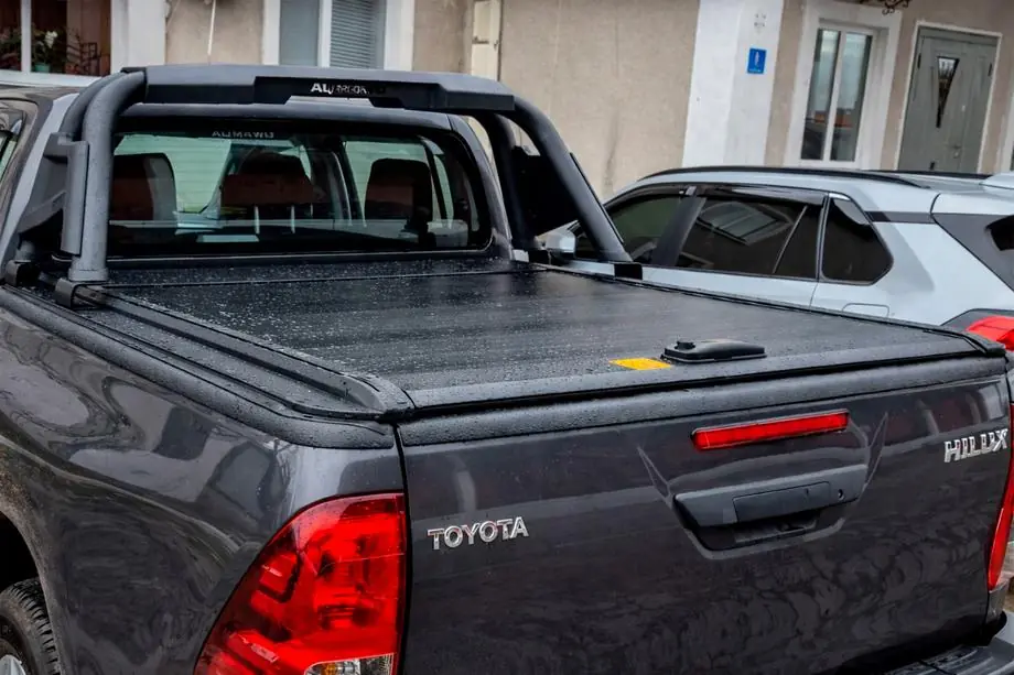 Toyota Hilux 2006-2015 Couvre-benne à lames OEM (2010-2015, manuel avec poignée et serrure) Photo 2
