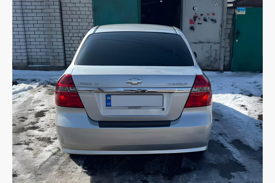 Chevrolet Aveo T250 2005-2011 Protection de pare-chocs arrière avec rebord Plastique Brillant, Berline - 4 Portes Photo 1